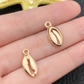 Golden alloy seashell pendant charm for DIY jewelry held on fingertips for size - KC Gold Marine Shell Style (18311)