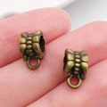 Enganche de bronce antiguo con textura de ondas para creación de joyas DIY - Enganche Triple Bronce Antiguo (20673)