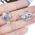 Pair of transparent resin dolphin charms with blue stone filling for DIY crafts - Blue Sequin Dolphin Style (19753)