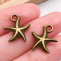 Colgantes de estrella de mar en bronce antiguo para joyería DIY sostenidos con dedos - Estrella de Mar Océano Bronce Antiguo (1675)