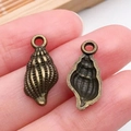 Colgante de concha vintage en aleación de bronce para creación de joyas artesanas - Caracola Océano Bronce Antiguo (20719)