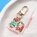 Macro shot of colorful enamel Christmas tree and snowman keychain charms with dimensions - Christmas Tree Sled Snowman U-Shape Keychain (ER835)
