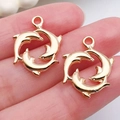 Colgante de tres delfines entrelazados en acabado oro pálido 14K para joyería DIY - Delfines en Círculo Oro KC (20710)
