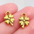 Gouden klaver hangers met gestructureerd oppervlak voor DIY sieraden maken - Antique Gold Four-leaf Clover (13x8mm)