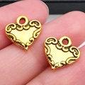 Vintage gouden hartvormige bedeltjes met reliëf voor DIY-sieraden maken - Antiek Gouden Krulwerk Hart (19986)