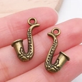 Colgantes de saxofón en bronce antiguo para creación de joyas y pulseras DIY - Saxofón (20897)