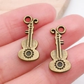Par de colgantes de guitarra de bronce vintage para joyería DIY en la punta de un dedo - Guitarra (20901)