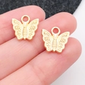 Colgantes de mariposa hueca dorada en aleación para creación de joyas DIY y llaveros - Estilo Mariposa Oro KC (11612) / 13x12mm
