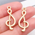 Par de colgantes de clave de sol dorados en metal para accesorios de joyería - Nota Musical (20931)