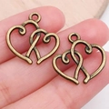 Set van twee vintage bronzen hartvormige hangers voor DIY sieraden maken - Antiek Brons Dubbel Hart (19938)