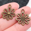 Retro bronzen zonnebloem hanger van legering met holle bloembladen voor DIY sieraden - Antique Bronze Hollow Flower (19x17mm)