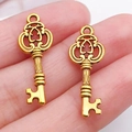 Dos colgantes de llave de corazón vintage dorados para creación de joyas DIY - Llave de Oro Antiguo (11370)