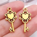 Colgantes de llave de corazón de aleación dorada vintage para joyería artesanal - Llave Corazón Oro Antiguo (20947)