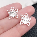 Colgantes de mariposa hueca plateados en aleación para creación de joyas DIY - Estilo Mariposa Plata Brillante (20187) / 13X15mm