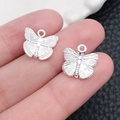 Colgantes de mariposa en aleación plateada para creación de joyas DIY en la mano - Estilo Mariposa Plata Brillante (20199) / 12x12mm