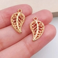 Set van twee goudkleurige holle bladhangers voor DIY sieraden maken en hobby - KC Goud Blad (10096)