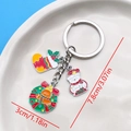 Christmas alloy keychain with snowman, stocking and wreath pendants on blue background - Snowman Wreath Gingerbread Man Sock Style (ER828)