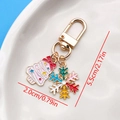 Golden Christmas keychain with red bow tree and colorful snowflake enamel pendant charms - Christmas Snowflake Tree U-Shape Keychain (ER833)