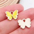 Pendentif papillon émaillé jaune avec bordure dorée pour la création de bijoux DIY - Jaune 12x11mm (12495)