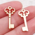 Set de dos colgantes de llave vintage en oro rosa con patrones ornamentados para DIY - Llave Pequeña Oro KC (21002)