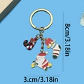Christmas keychain with colorful oil-drop charms featuring Santa and candy cane, 8cm size - Christmas Sock Candy Santa Keychain (ER816)