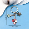 Christmas tree and Santa Claus enamel keychain in gold finish with dimensions shown - Christmas Tree Snowflake Santa Keychain (ER818)
