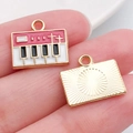 Miniature electronic synthesizer charm with red enamel keys and golden metal back - Piano Style / Rose Red