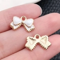 White enamel bow pendant with gold plated metal finish and textured back for DIY jewelry - Bowknot 15.5x10mm (12250)
