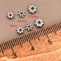 Macro shot of 18K gold plated snowflake spacer beads in 4mm, 4.5mm and 5.5mm sizes - 4mm / White Gold