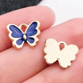 Pendentif papillon en émail bleu avec cadre doré et dos texturé pour bijoux DIY - Bleu Foncé 12x11mm (12493)