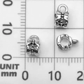 Silver bow-shaped spacer beads showing front and side holes on measuring scale - Bail Bead Hanger (21077)