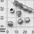 Vintage silver-plated metal barrel bead with pineapple texture on measurement grid - Spacer Bead (21086)