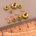 Macro view of 4-8mm gold plated wheel spacer beads shown with a ruler for size reference - 4mm / 18k Gold
