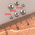 Foto macro de cuentas espaciadoras plateadas de 3mm, 4mm y 5mm para creación de joyas - 3mm / Platino