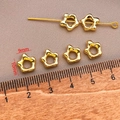 Macro detail of 18k gold plated star spacer beads with 10mm measurement on a wooden ruler - 18K Real Gold Long Lasting