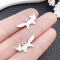 Vintage silver fox alloy charm pendants for DIY jewelry making being held by hand - Antique Silver Fox Style (10370)