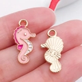 Pink seahorse alloy pendant charm for DIY jewelry with white enamel and golden backing - Pink Enamel Ocean Seahorse Style
