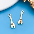 Paire de pendentifs dorés en forme de clé pour bijoux DIY et porte-clés personnalisés - Clé à Molette (18330)