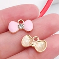 Pink enamel bow pendant with center crystal and gold metal base for DIY jewelry - Pink Enamel Rhinestone Bowtie Style
