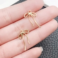 Ciondoli a fiocco traforati in lega di zinco dorata per gioielli fai da te e borse - Fiocco Lineare (20x12mm)