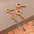 Vue macro de pitons à vis dorés 18 carats 4x8mm et 5x10mm pour bijoux artisanaux - Longueur 8mm * Largeur 4mm * Goupille 1,0mm / Or 18K