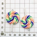 Rainbow spiral lollipop resin pendant with metal hooks on a grid measurement board - Color Resin Lollipop 29x55mm
