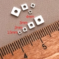 Detail showing various sizes of 18K gold plated square spacer beads for jewelry making - 2mm / Square Spacer (approx. 0.024g) / White Gold