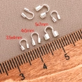 Three sizes of silver U-shape wire protectors for jewelry making next to a wooden ruler - U-Shape Wire Guardian 4x4mm Hole 1mm / Silver