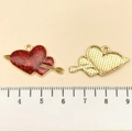 Cupid arrow heart pendant with glitter red enamel and gold back on a scale - Red Glitter Enamel Arrow Heart (21459) / 16x27mm