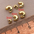 Detail of 18K gold plated C-shaped crimp bead covers in 3mm, 4mm, and 5mm sizes for DIY jewelry - 4x3.45x2.7mm / 18K Gold