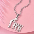 Detailed macro view of silver family silhouette pendant necklace on elegant pink display - Two Sons Two Daughters Silhouette