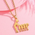 Close-up of golden stainless steel family pendant showing mother and five children silhouette - Gold Four Daughters Silhouette
