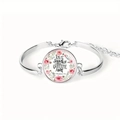 Macro detail of silver Bible verse bracelet with rose wreath and Give Thanks text - 1 Thessalonians 5:18 Inspirational Quote (Give thanks with a grateful heart)