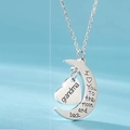 Macro shot of silver crescent moon and heart pendant with Grandma and sentimental engraving - Grandma (Style 3)